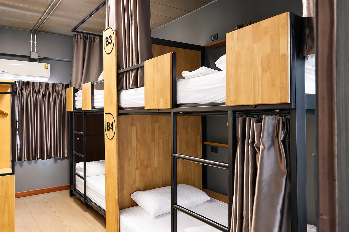 Bunks B3 and B4, privacy curtains drawn back.