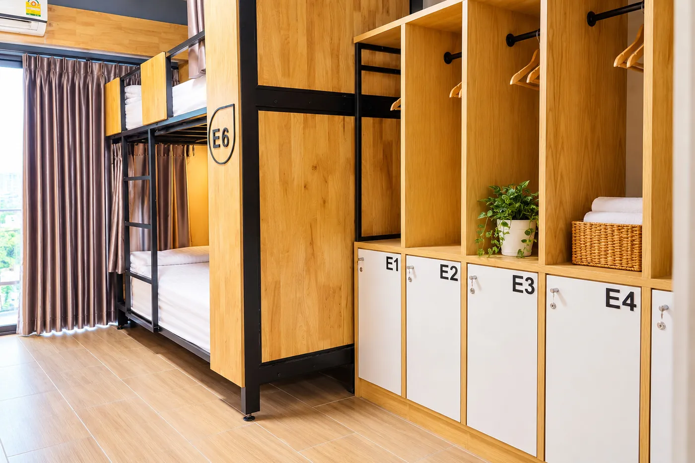 The wardrobe and lockers E1 to E4 beside the bunks.