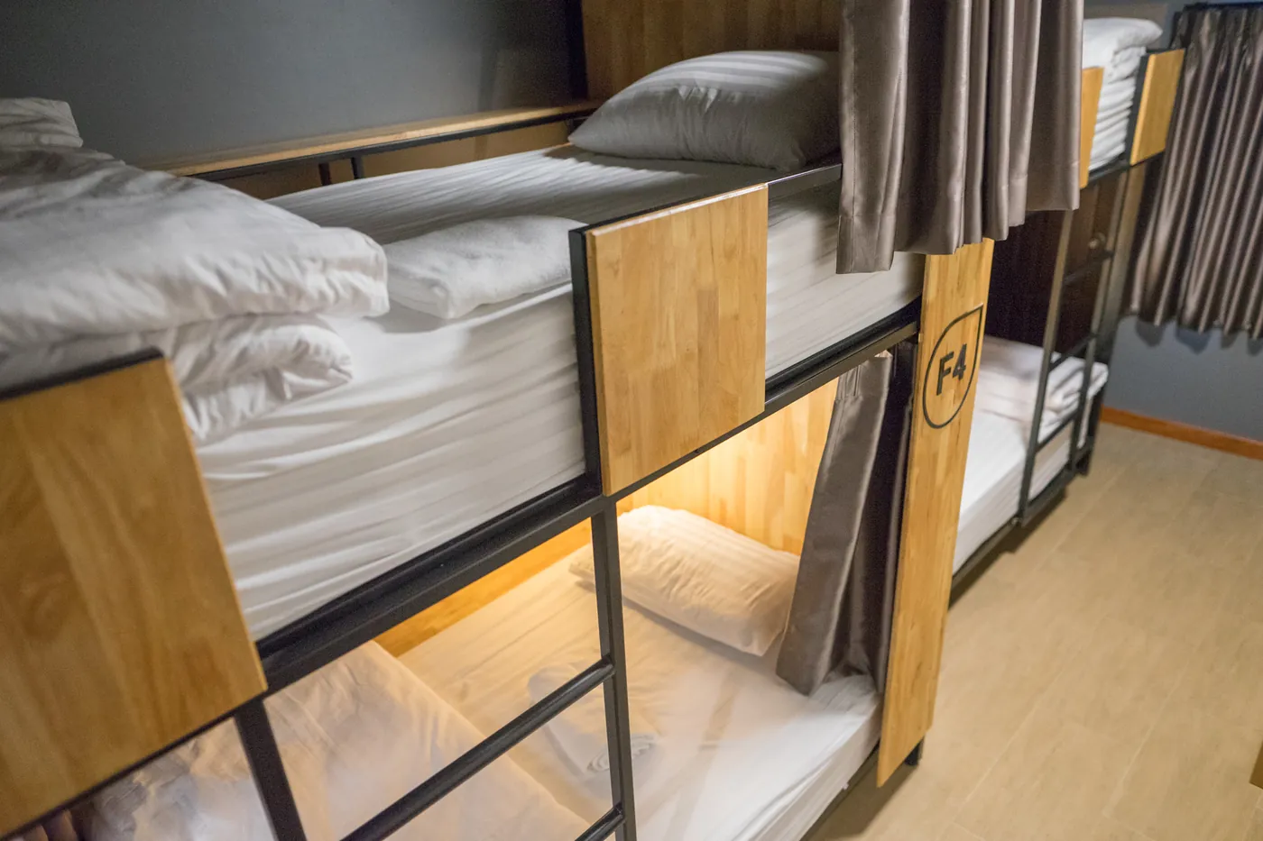 The two bunks of room F, made up in white.